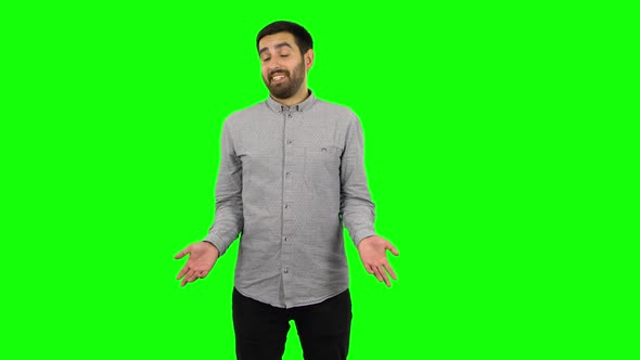 Brunette Guy Is Shrugging and Sighing. Green Screen