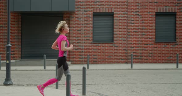 Young Woman Jogging in the City Doing Sports in the Morning