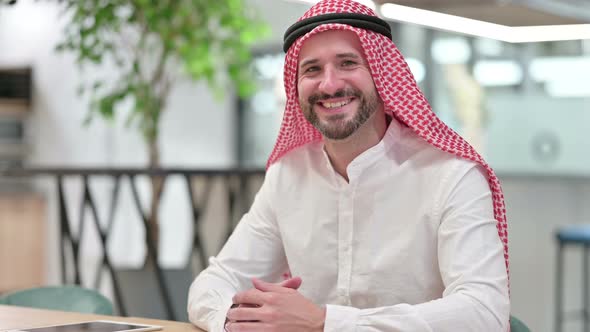 Happy Arab Businessman Smiling at Camera 
