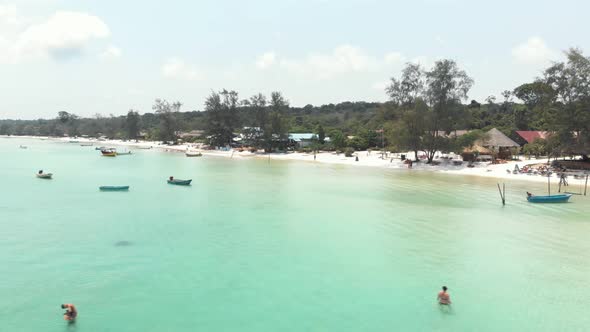 Holidaymakers enjoy the tropical saracen bay beaches, koh rong samloem 