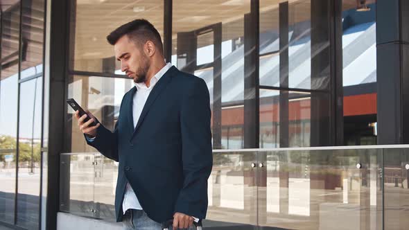 Elegant businessman in airport. Young mail entrepreneur in formalwear.