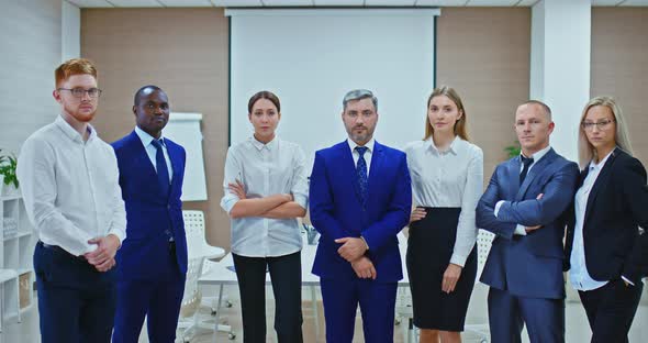 Business People in Suits are Standing in the Office Serious Looks a Team of Businessmen