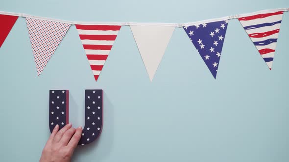 Painted USA sign with white, red and blue on blue background.