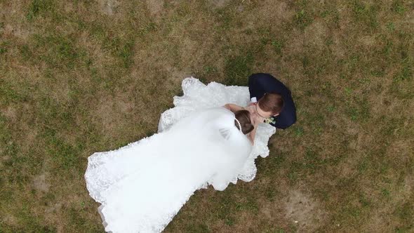 Bride and Groom Embracing Outdoors in Wedding Day