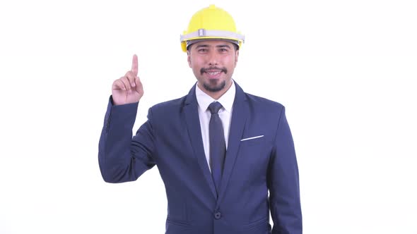 Happy Bearded Persian Businessman As Engineer Pointing Up