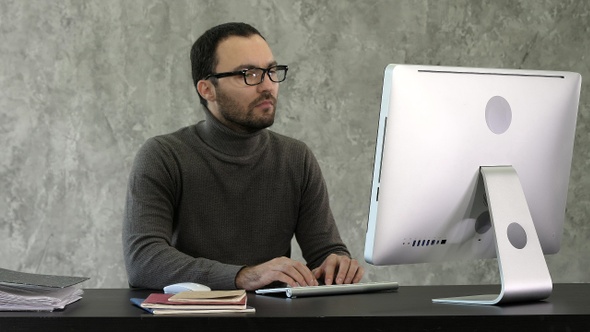 Programming. Man Working On Computer In IT Office Sitting