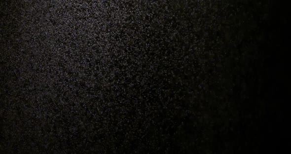 The Effect of Spraying Water on a Black Background Is Suitable To Replace in Your Video