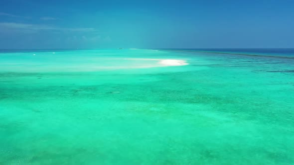 Aerial drone view seascape of relaxing coastline beach holiday by blue sea with white sandy backgrou