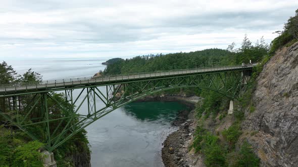 Wide orbiting shot of the Deception Pass bridge on Whidbey Island.