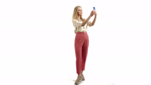 Young Blonde Charming Elegant Girl Taking a Selfie Copy Space Isolated Studio Shot Full Shot