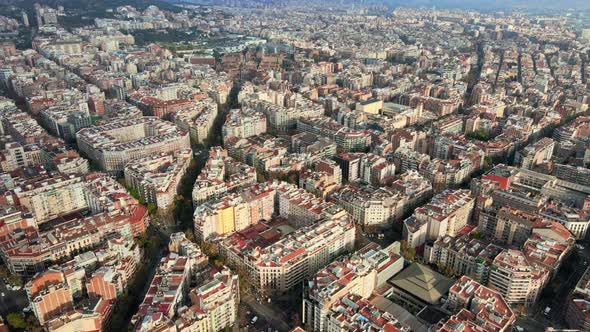 Aerial drone view of Barcelona, Spain. Blocks with multiple residential buildings, roads with cars