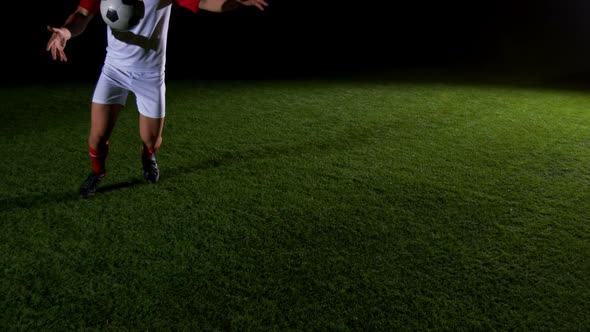 Soccer player kicking the ball