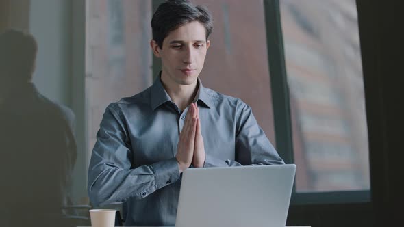 Portrait of Caucasian Business Man Manager Wears Formal Shirt Sitting at Table Looking Into Laptop