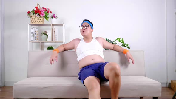 Fat Asian glasses man in sportswear crave looking and whistling sexual harassment girl or woman