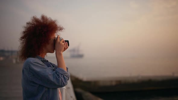 Beautiful Female Phorograph Smiling Taking Picture at Seaside Slow Motion