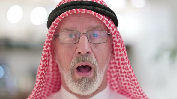 Close Up of Senior Old Arab Man Feeling Shocked at the Camera 