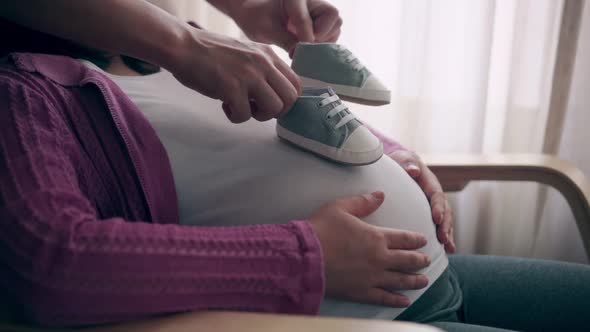 Pregnant Couple Feels Love and Relax at Home