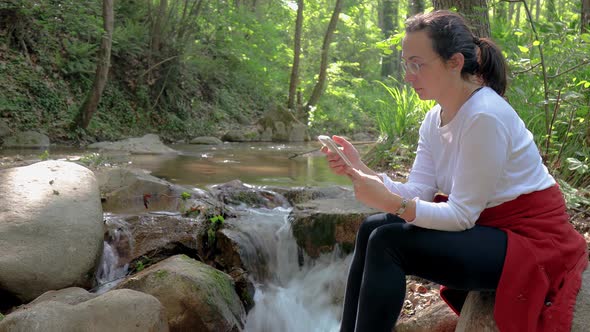 Spanish woman on the river bank 