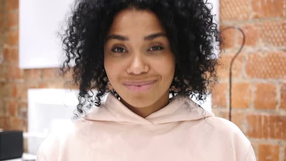 AfroAmerican Woman Shaking Head to Accept Yes Indoor