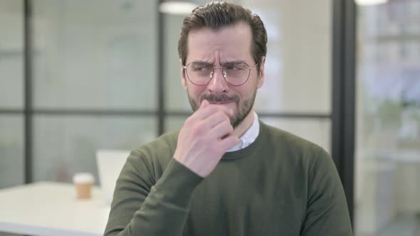 Portrait of Young Businessman Smelling Something Bad Odor