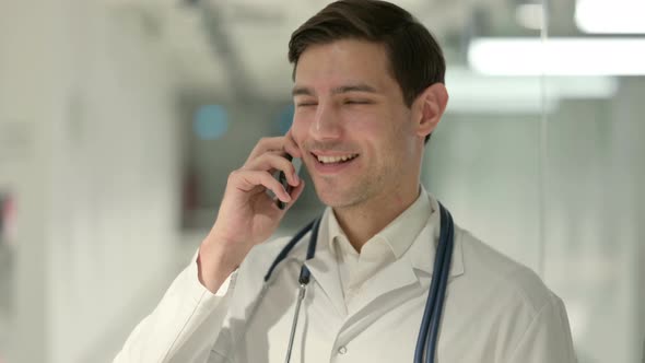 Portrait of Male Doctor Talking on Smartphone