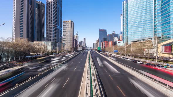 Timelapse of busy traffic road with modern office building in beijing china