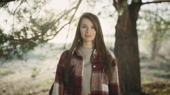 Portrait of a Beautiful Young Woman in a Casual Shirt