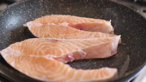 Red Fish in a Frying Pan Cook Sprinkles Red Pepper Salmon Fish