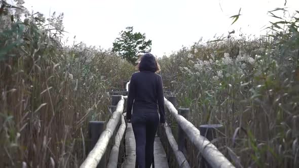 Girl leaving the bird watching lake