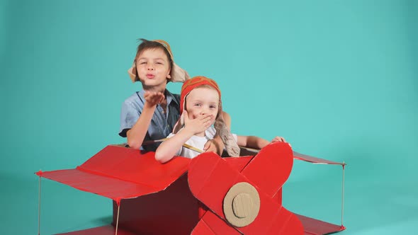 Sweet Caucasian Boys in Pilot Helmet Imagine Flight