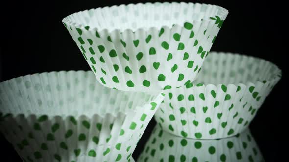 Stack Of Green Polka Dots Cupcake Paper Cups - Cupcake Liners. - macro, rotating