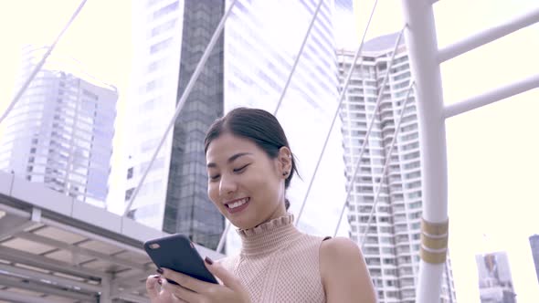 Asian Woman Chatting On Phone