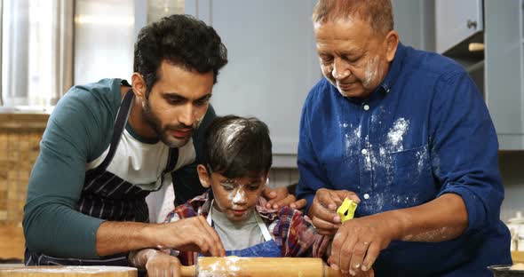 Happy family preparing cookies in kitchen 4k