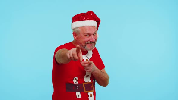 Man in Red Christmas Tshirt Smiling Excitedly Pointing to Camera Beauty Choosing Lucky Winner