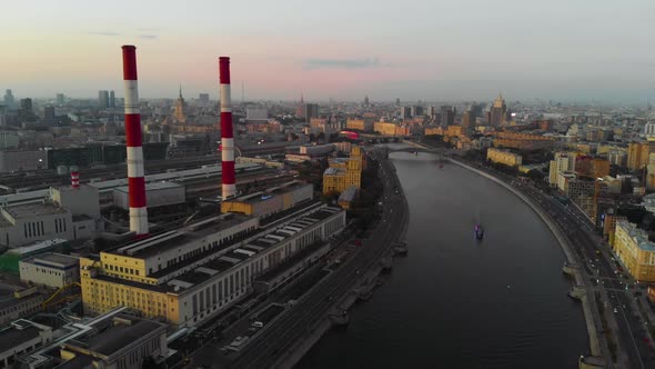 Aerial View of the City of Moscow and the Moscow River at Sunset. Industrial Pipes in the Center of