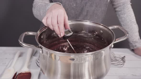 Step by step. Mixing ingredients in the cooking pot to make simple chocolate fudge.