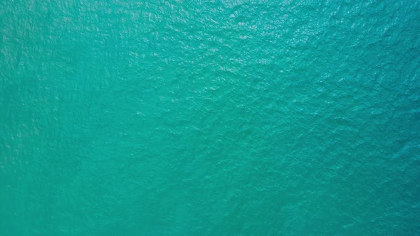 Aerial view top-down of blue water surface