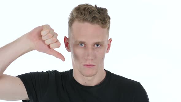 Thumbs Down By Young Man on White Background