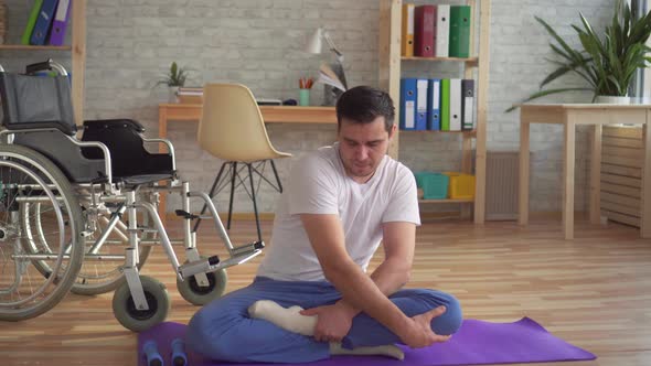 Disabled Man Doing Yoga Recovering From Injury