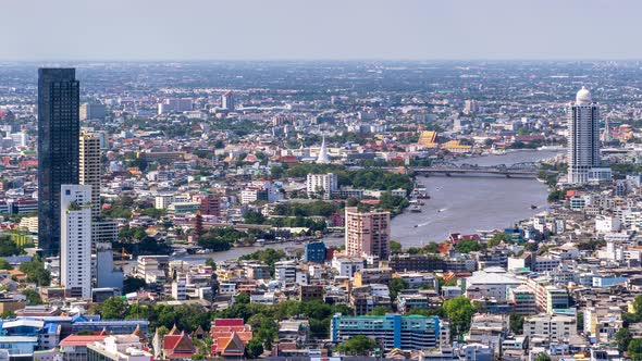 Bangkok city above old town area and Chao Phraya River, with water traffic – Time Lapse