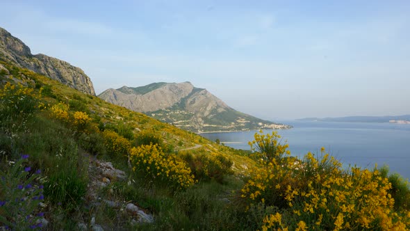 4K Cinematic nature travelling footage of a panoramic view of the cliffs and mountains of Omis next