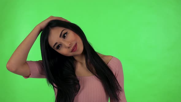 Young Attractive Asian Woman Does Stretching - Green Screen Studio