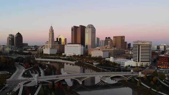 Columbus Ohio Skyline at dusk with the Scioto River in the foreground
