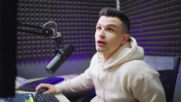 a Male Radio Host on the Air in the Radio Studio