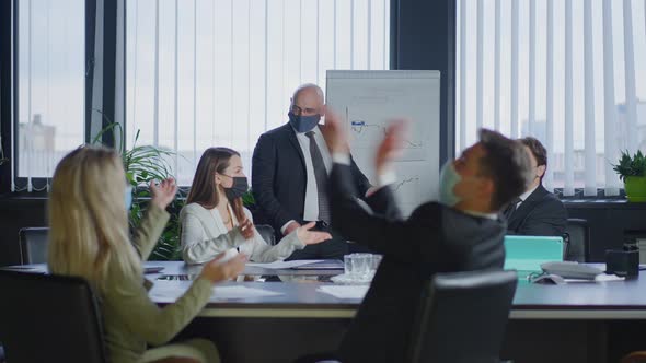 Group of Business People in Coronavirus Face Masks Clapping Supporting Business Strategy Idea As