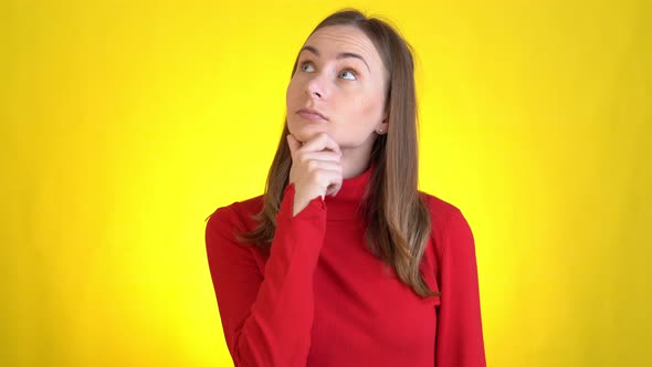 Young Woman Isolated on Yellow Background in Studio