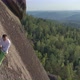 A Young Man Descends From a Rock Mountain on a Rope. - VideoHive Item for Sale
