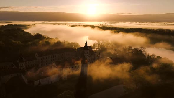 Amazing Dawn in the Foggy Nesvizh, Fog Over the River. Nesvizh. Ancient Castle . Belarus