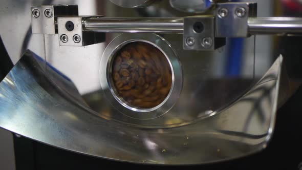 Coffee bean tumbling around inside roasting machine
