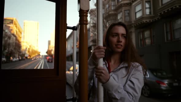 Woman using a tram on a city street